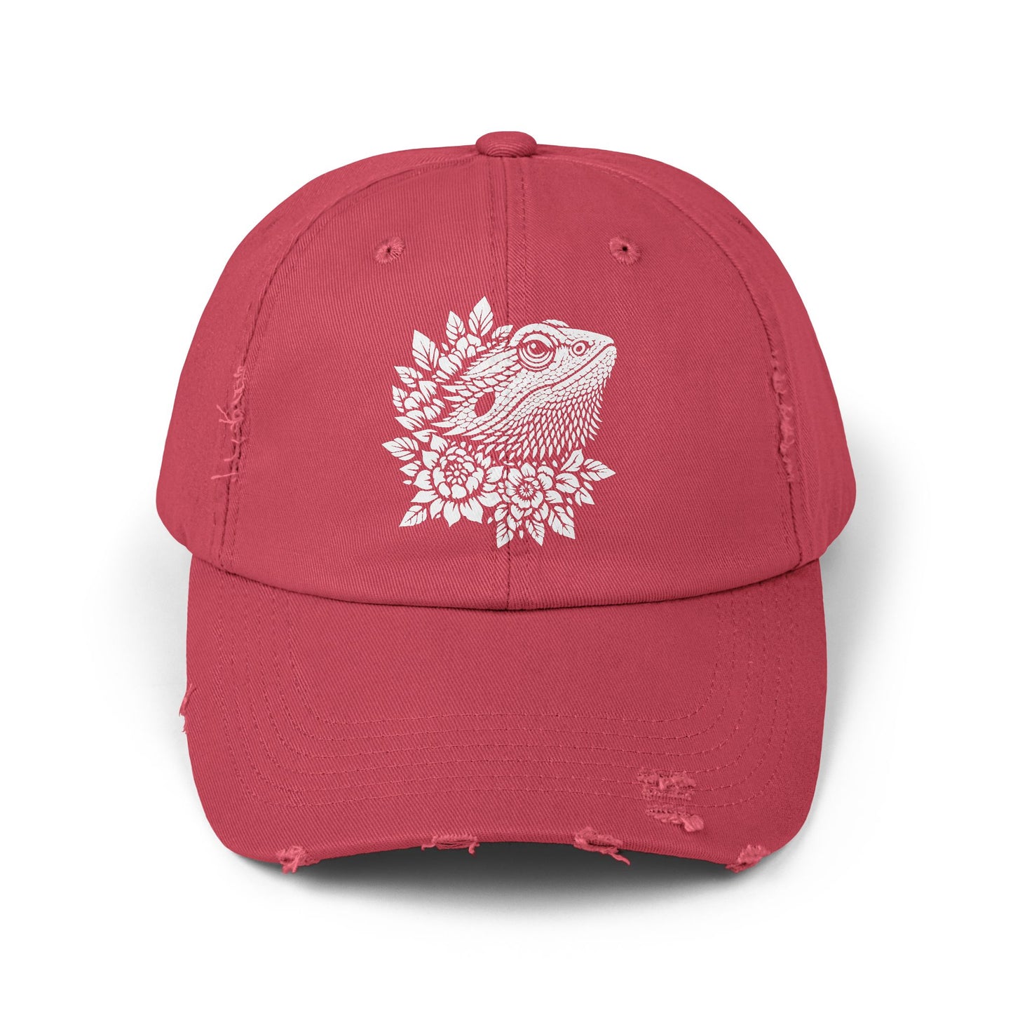 A red baseball cap with a white design featuring a bearded dragon or lizard.