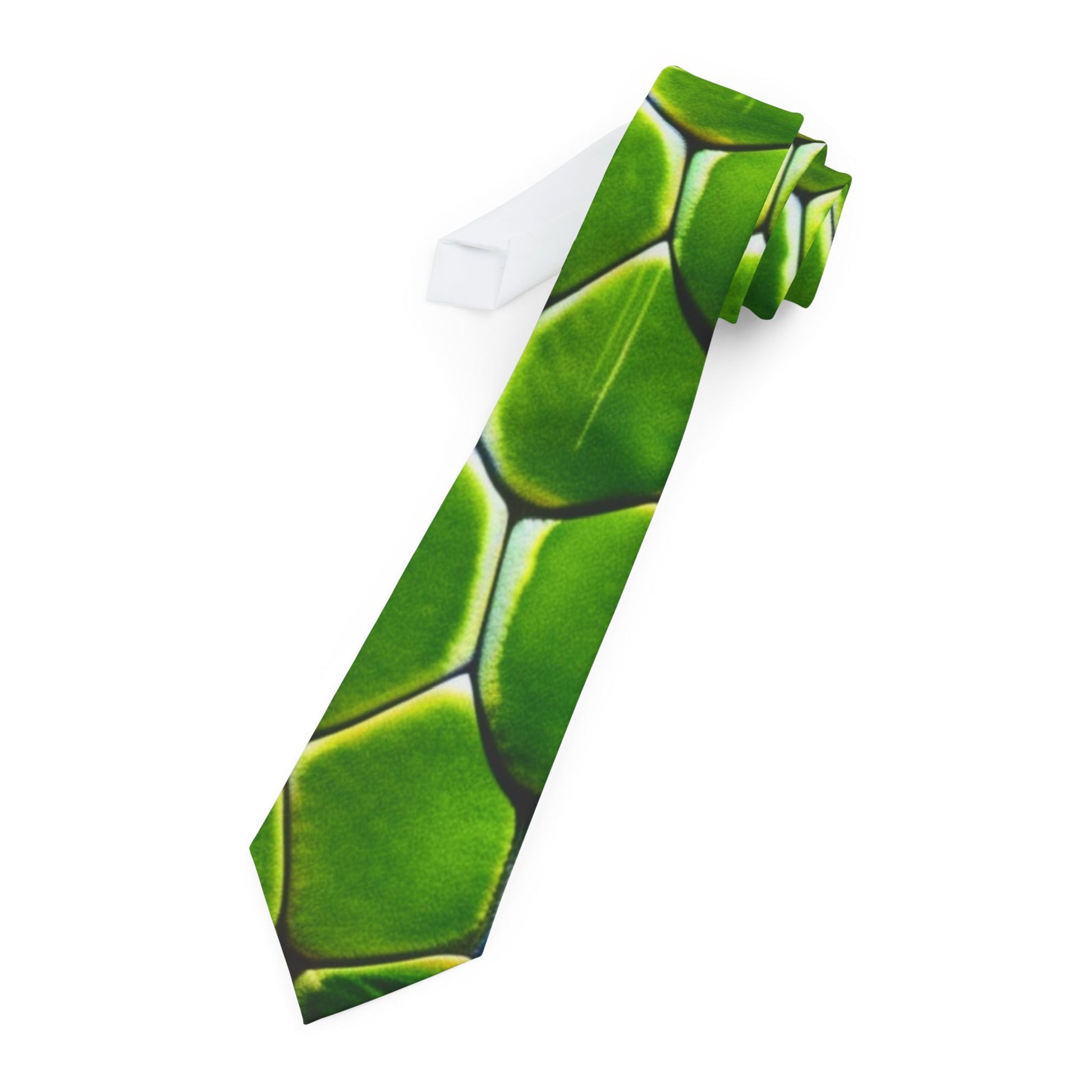 A green tie with a pattern of overlapping hexagons is shown against a white background.