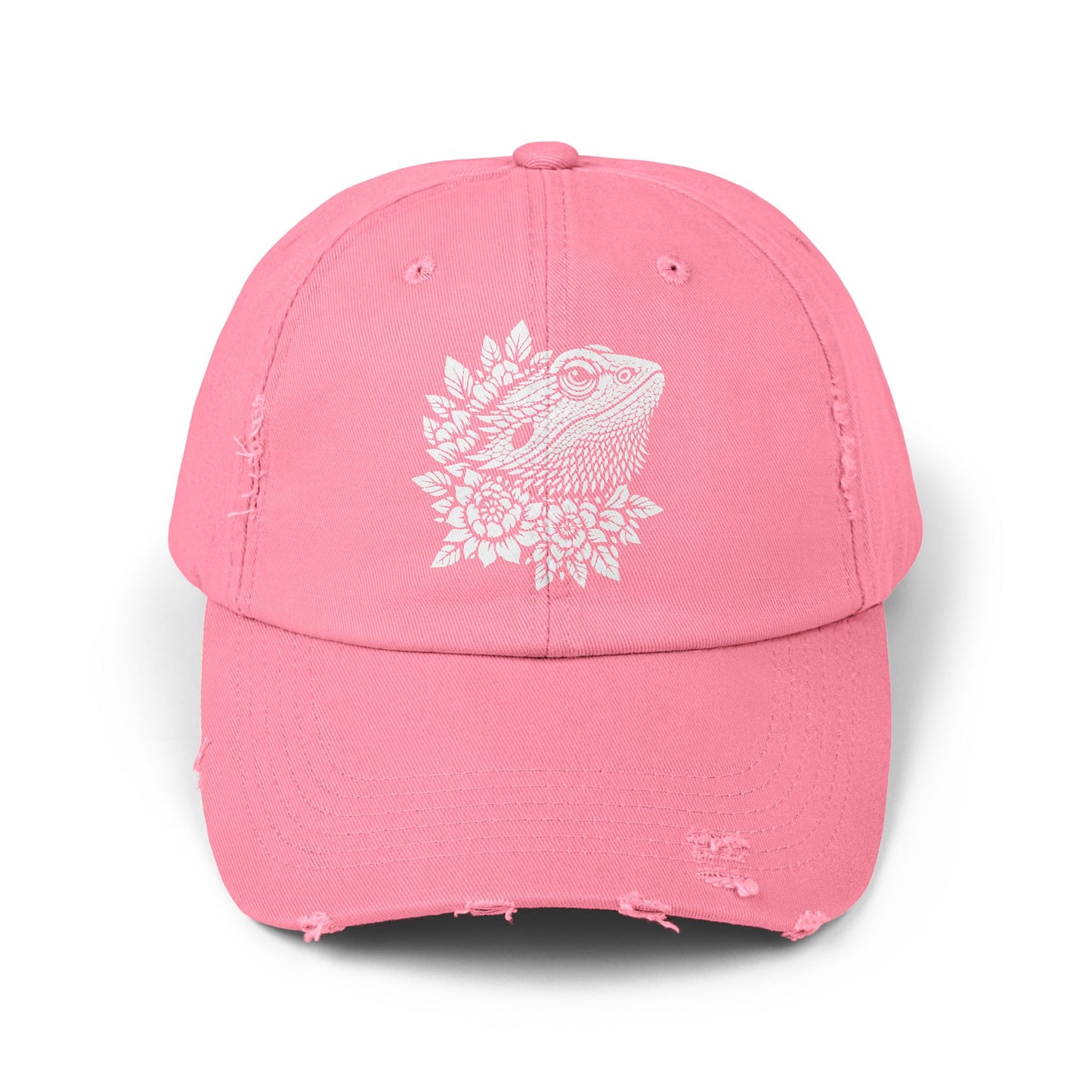 A pink baseball cap with a white design of a bearded dragon on the front.