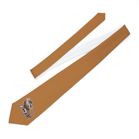 a brown tie with a dragon design on it.