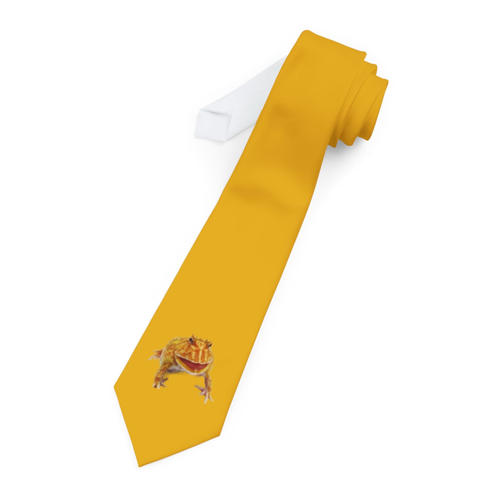 a yellow necktie with a printed image of a frog on it.