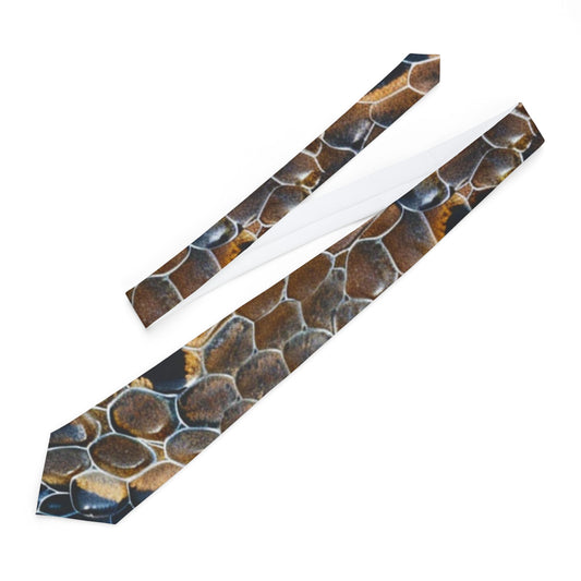 a tie with a unique pattern of hexagonal shapes in shades of brown and black.