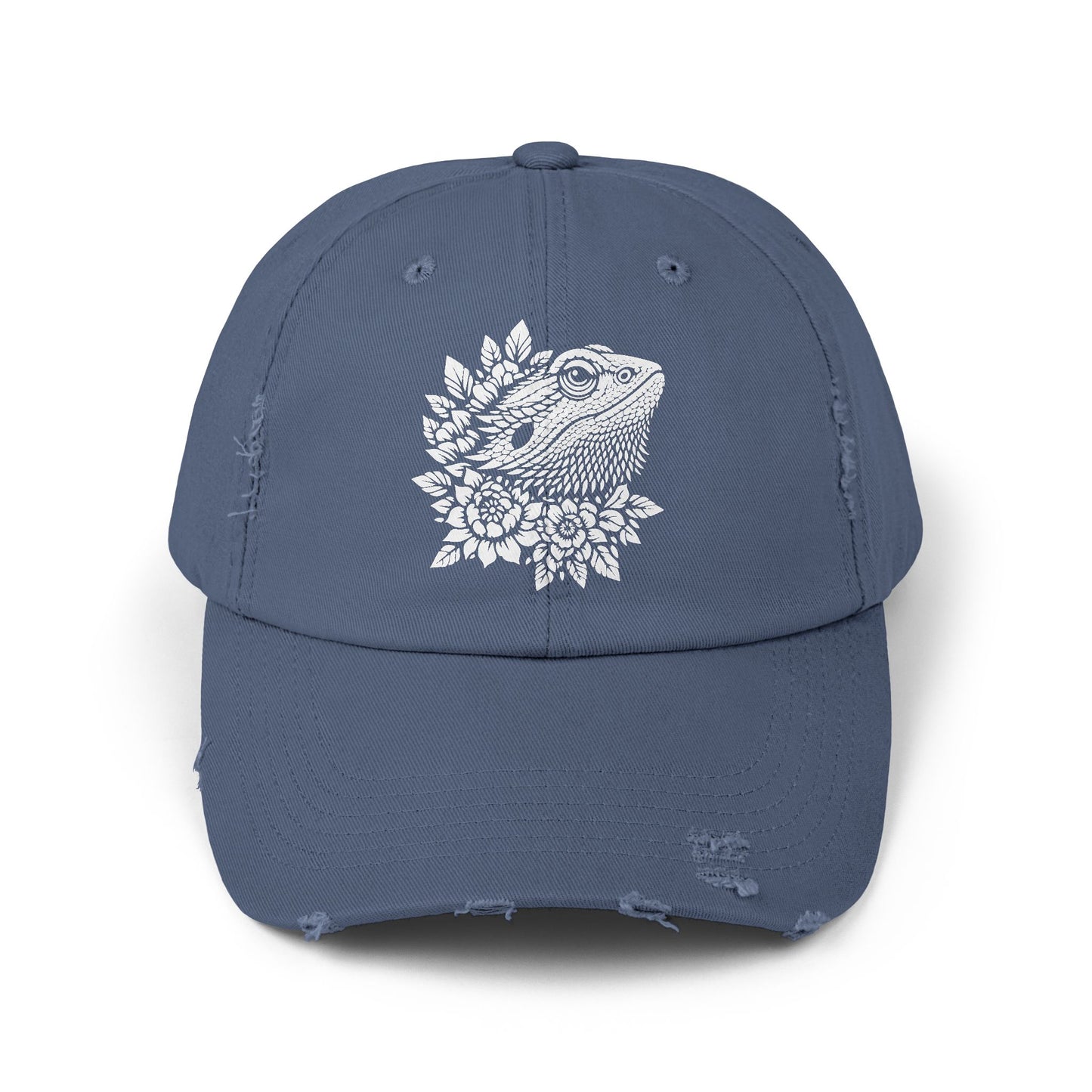 A blue baseball cap with a white graphic of a bearded dragon on the front.