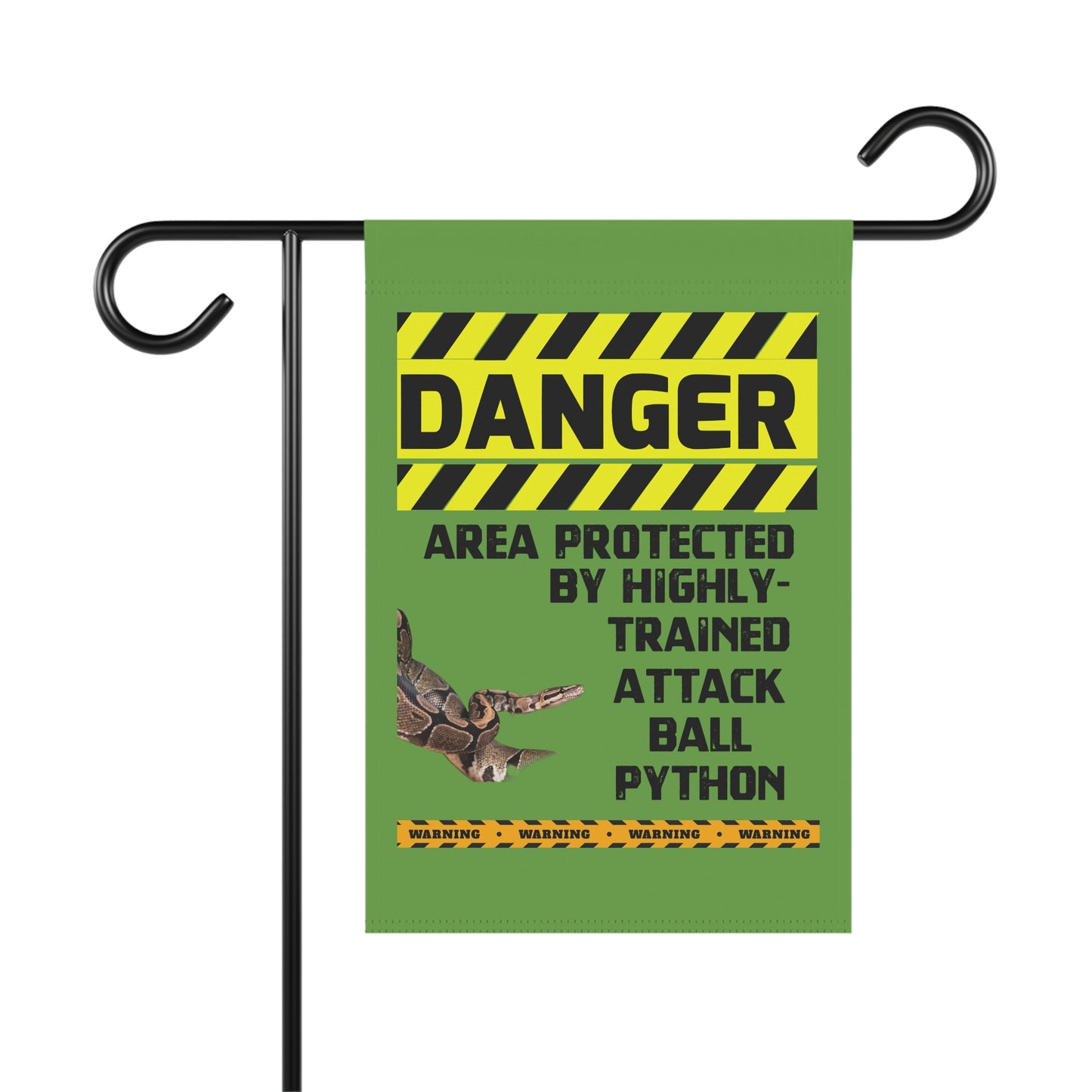 a green sign with a yellow and black striped border, warning that the area is protected by highly trained attack ball Python.